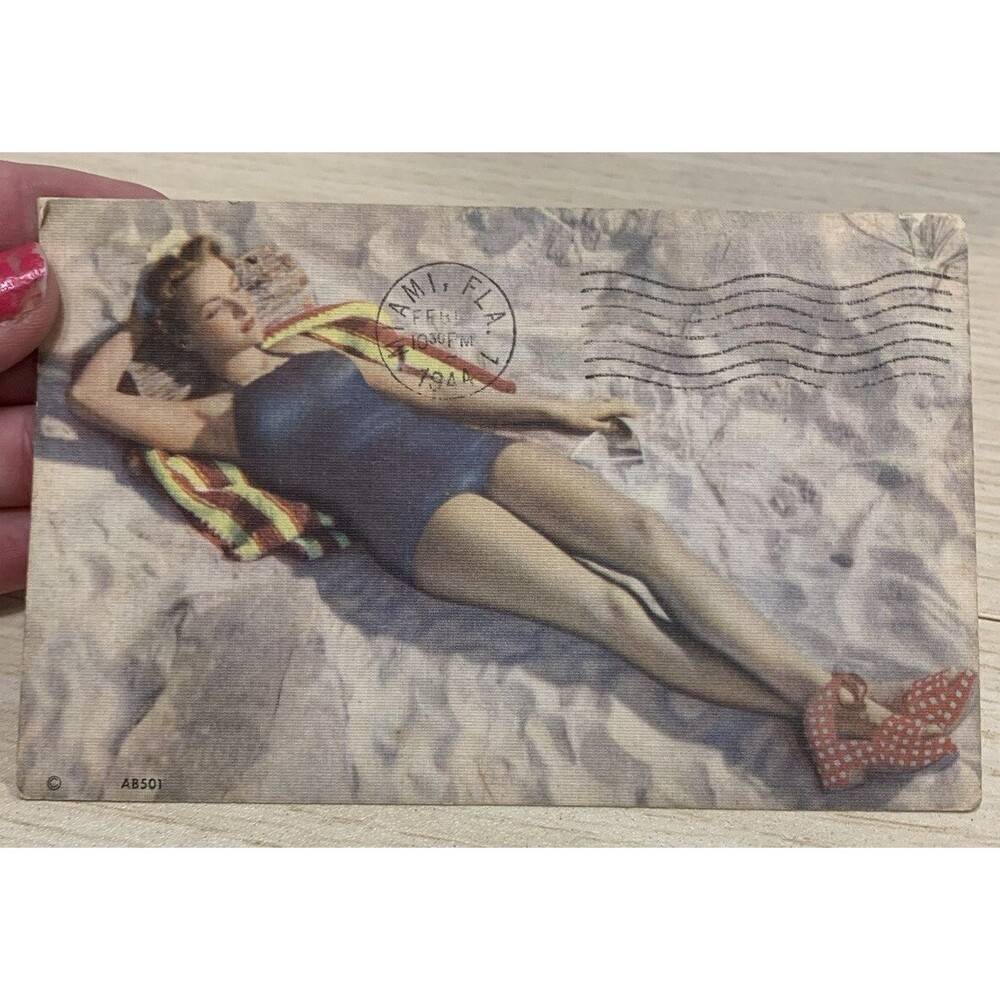 Vintage Postcard Woman Sunbathing in ‘40s style swimsuit & Shoes Postmark 1944